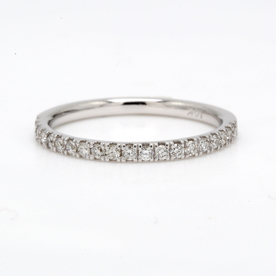 Band with 4-prong set (20) round diamonds.  D0.29ct.t.w.  Size 7.25