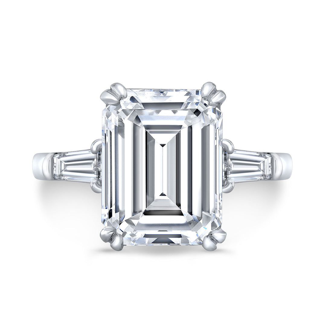 3-stone ring with GIA certified H/VS2 emerald cut and channel set tapered baguette diamond sides.  D6.50ct.t.w.  (Center - 6.02ct.)  Size 6.5