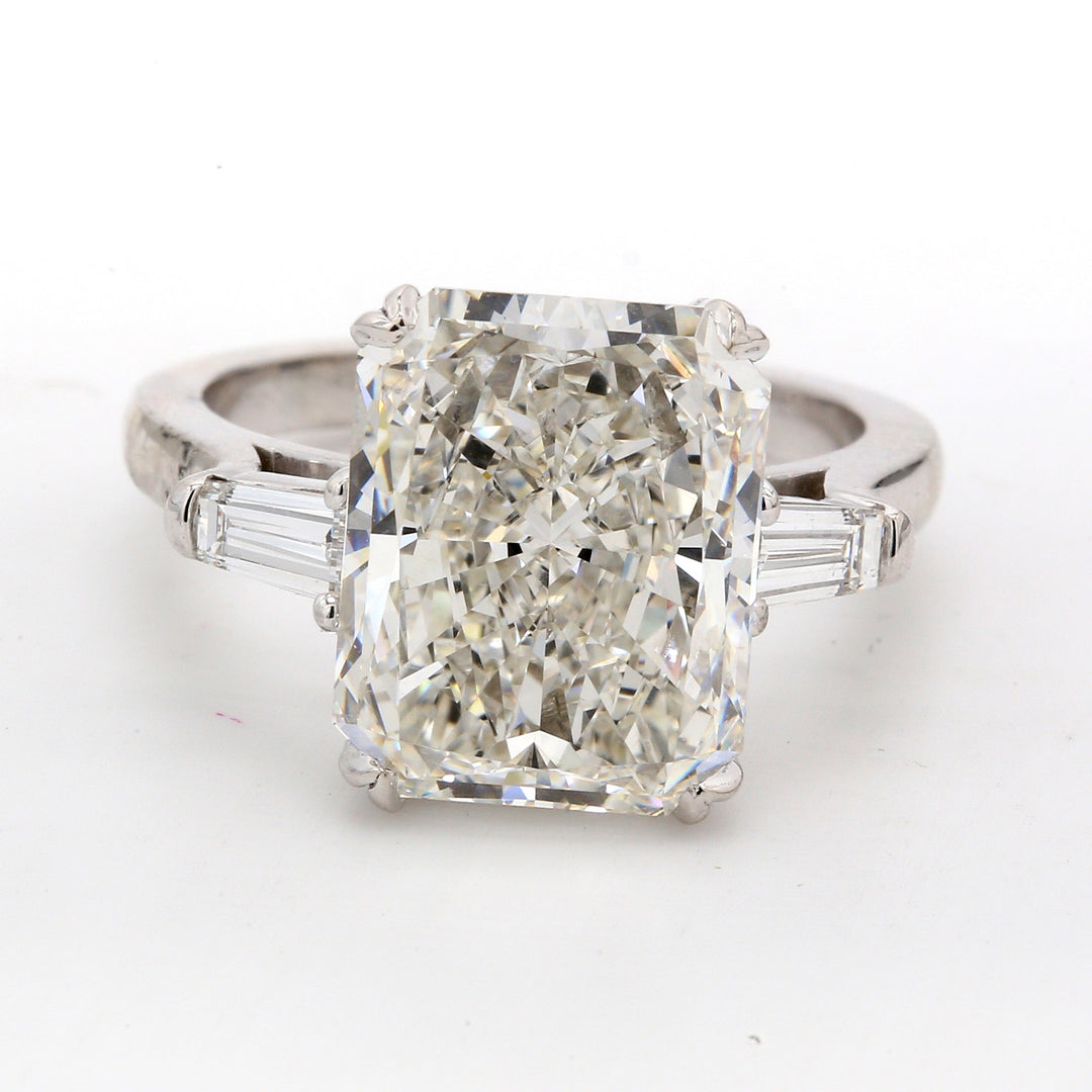 3-stone semi-mount in platinum with channel set baguette diamond sides.  D0.50ct.t.w.  Size 6.5