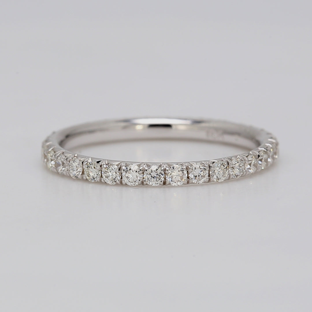 Eternity band in 18K WG with french pave set round diamonds.  D0.59ct.t.w.  Size 5