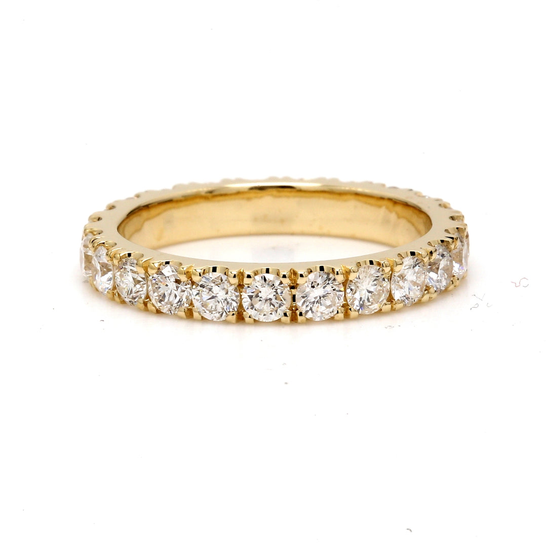 Eternity band in yellow gold with U-prong set round diamonds.  D1.50ct.t.w.  Size 5