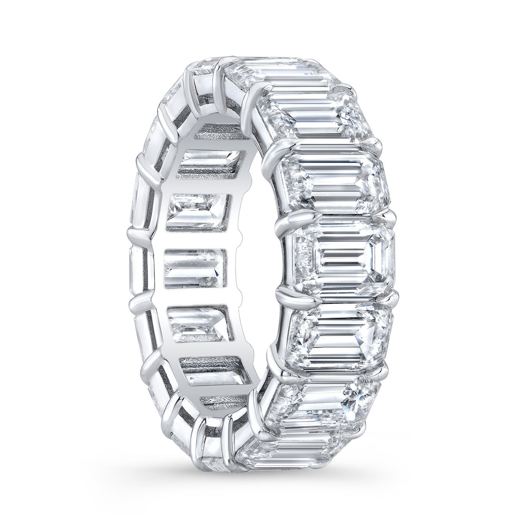 Eternity band in 18K WG with shared prong set emerald cut diamonds.  D5.85ct.t.w.  Size 4.75