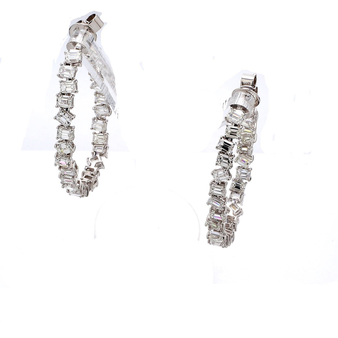 1.5"" Inside out hoop earrings in 18K WG with prong set emerald cut diamonds.  D7.29ct.t.w.