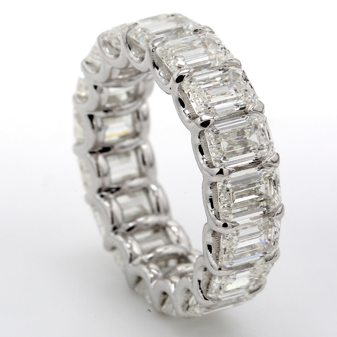 Eternity band in platinum with shared U-prong set GIA certified I/IF-VS2 (17) emerald cut diamonds.  D9.13ct.t.w.  Size 6.25