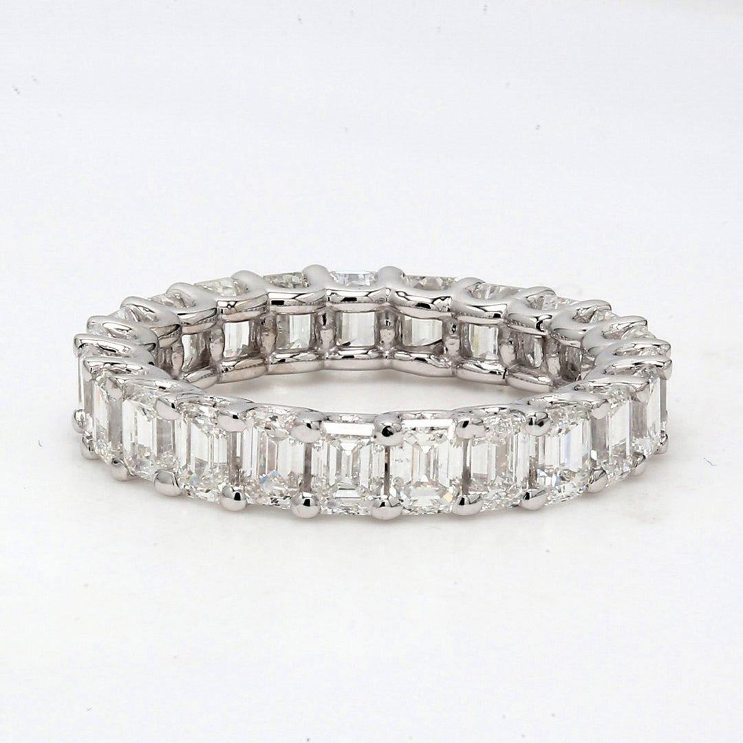 Eternity band with U-prong set (26) emerald cut diamonds.  D3.56ct.t.w.  Size 5.75