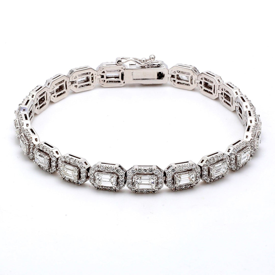 7"" Halo tennis bracelet with combination shared prong set and 4-prong set round and emerald cut diamonds.  D7.99ct.t.w.