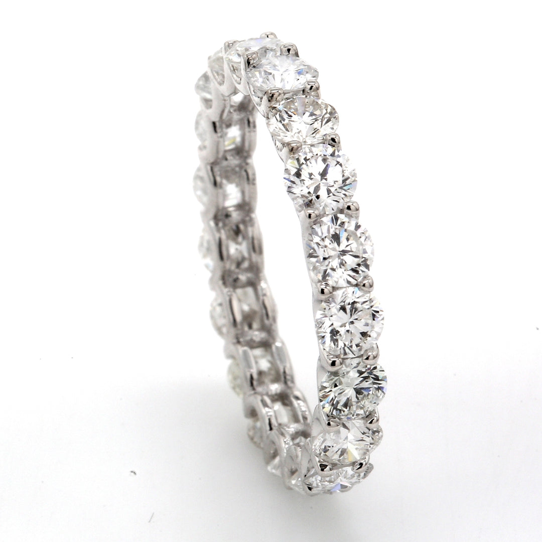 Eternity band in 18K WG with shared U-prong set (19) round diamonds.  D2.74ct.t.w.  Size 5.5