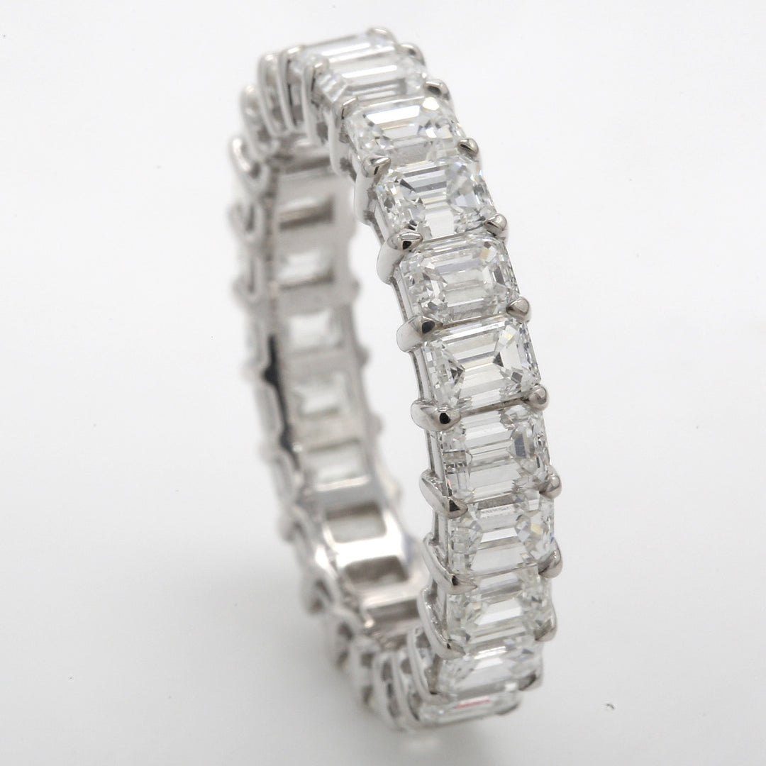 Eternity band with basket prong set (24) emerald cut diamonds.  D4.52ct.t.w.  Size 6.5