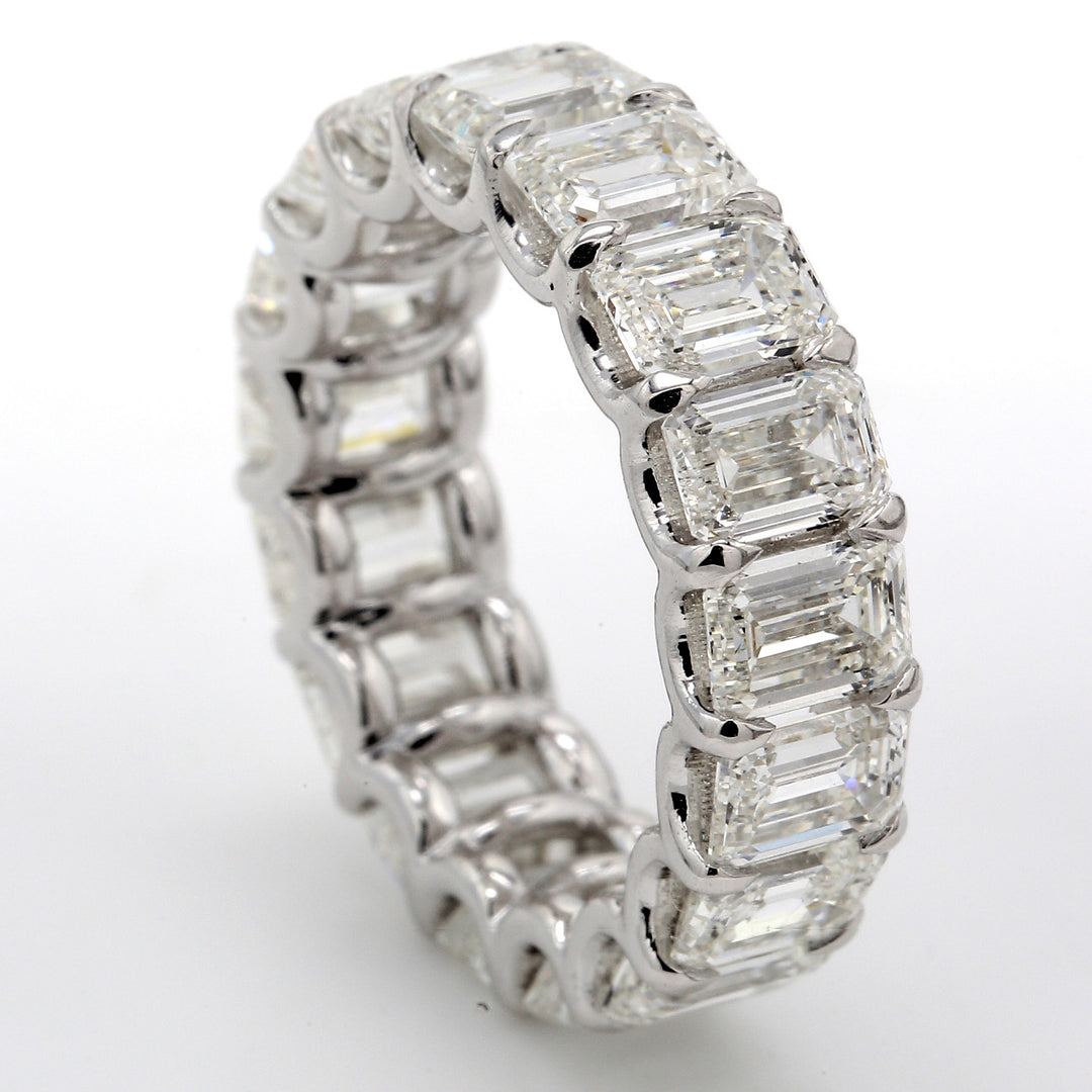 Eternity band in platinum with U-prong set GIA certified D-E/VVS1-VS2 (17) emerald cut diamonds.  D8.67ct.t.w.  Size 5.75