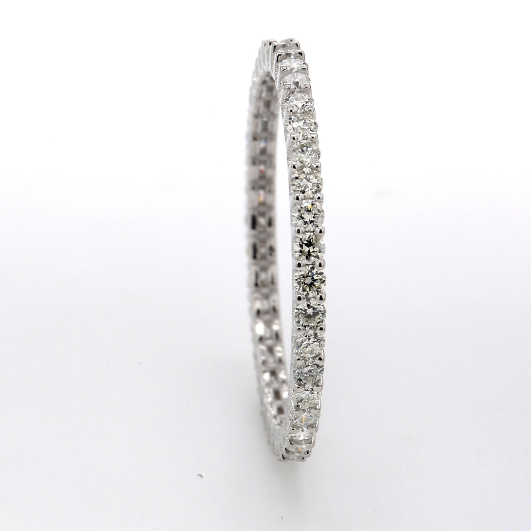 Eternity band with shared 4-prong set (37) round diamonds.  D0.55ct.t.w.  Size 5.5