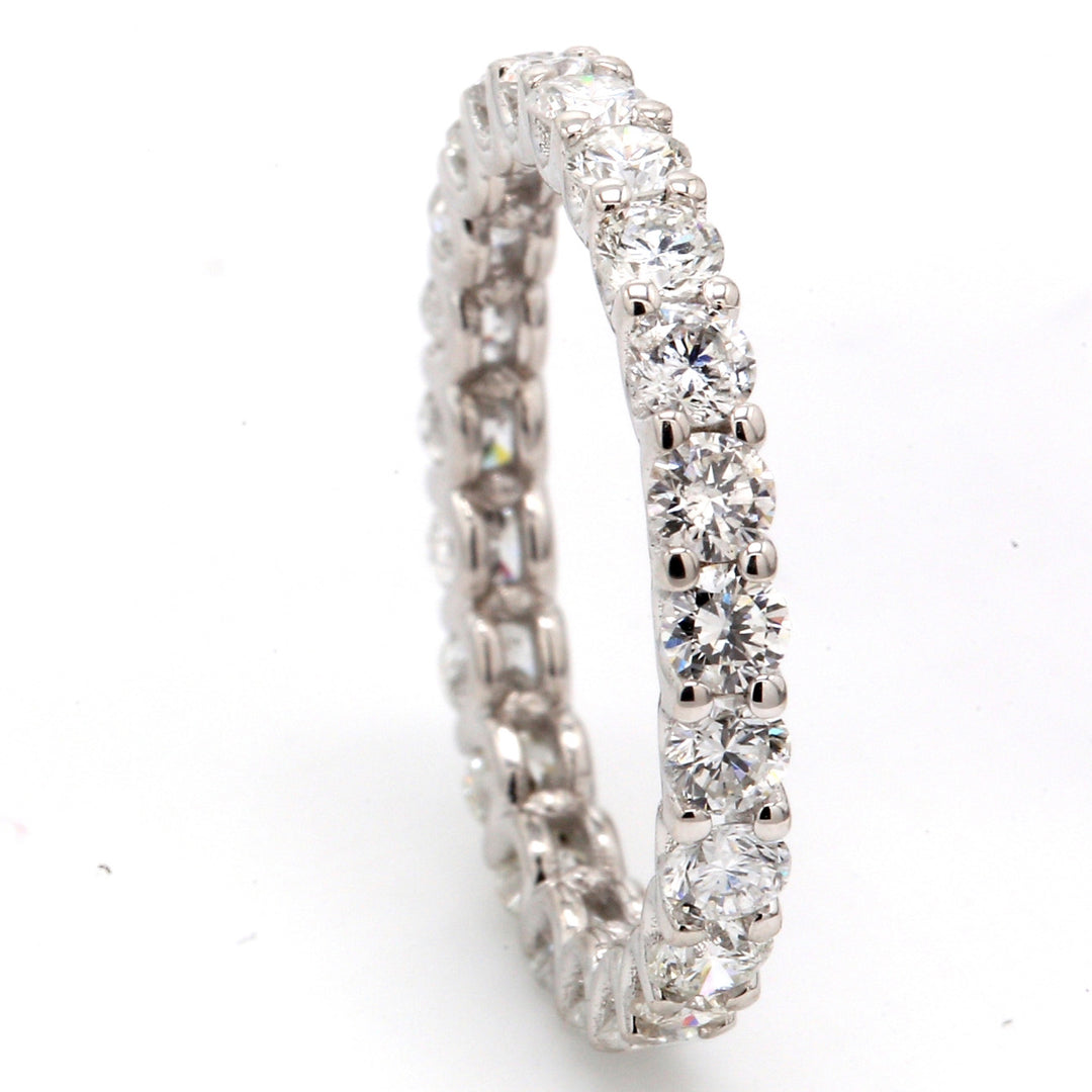 Eternity band in 18K WG with U-prong set (23) round diamonds.  D1.49ct.t.w.  Size 5