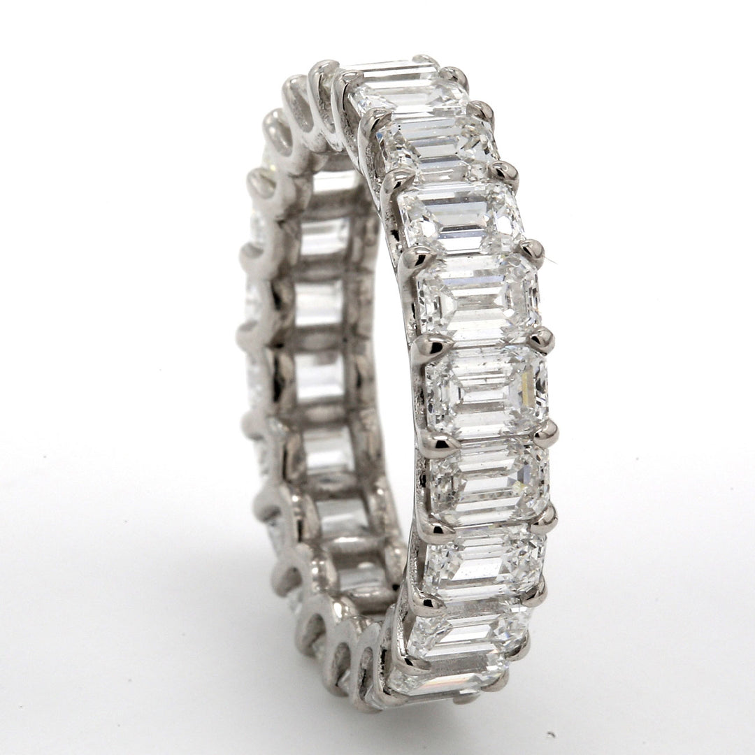 Eternity band in platinum with U-prong et (22) emerald cut diamonds.  D4.98ct.t.w.  Size 5.5