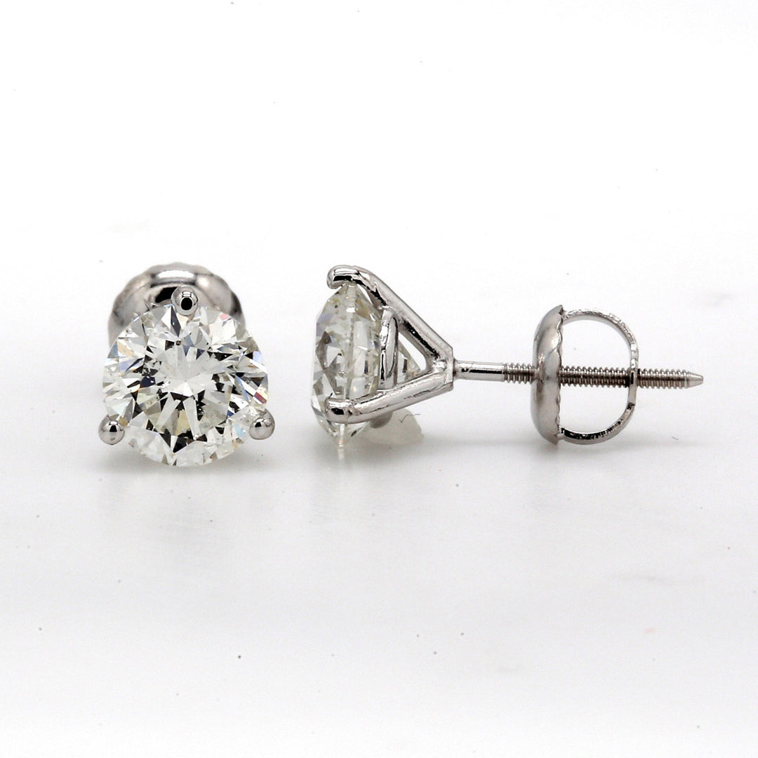 Screw back stud earrings with eagle claw prong set martini style  with round diamonds. D3.00ct.t.w