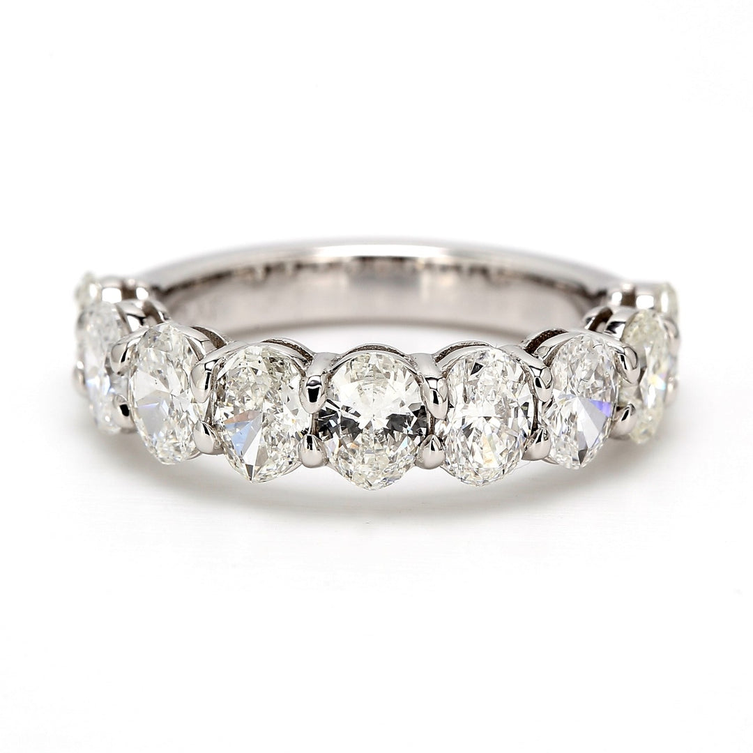 9-stone band in platinum with shared basket prong set oval cut diamonds.  D2.46ct.t.w.  Size 6