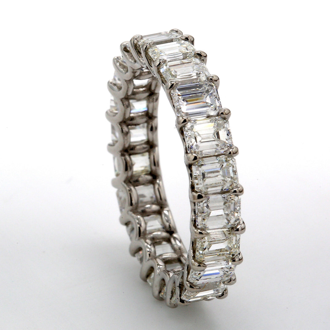 Eternity band in platinum with U-prong set (22) emerald cut diamonds.  D4.24ct.t.w.  Size 5.5