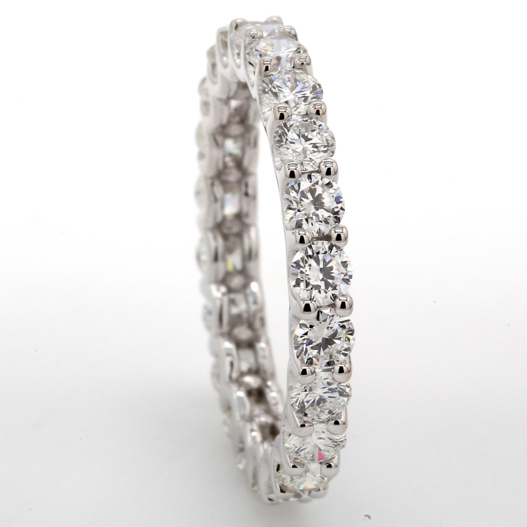 Eternity band in 18K WG with U-prong set (23) round diamonds.  D1.86ct.t.w.  Size 5.25