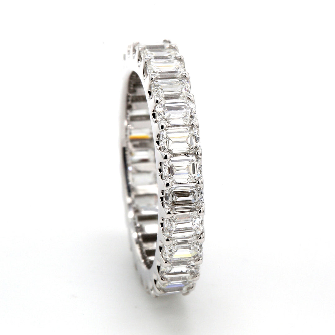 Eternity band with shared U-prong set emerald cut diamonds.  D2.55ct.t.w.  Size 5.5