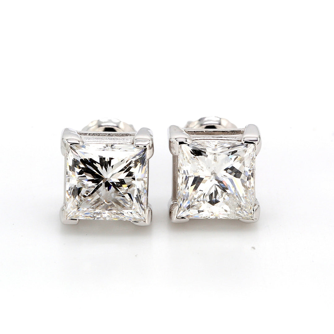 Push back stud earrings with 4-prong set princess cut diamonds.  D1.40ct.t.w.