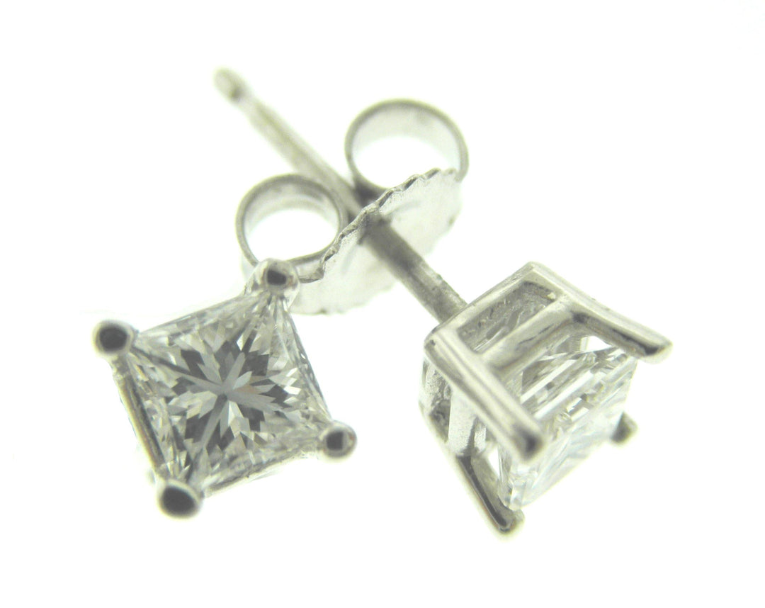 Screw back stud earrings with prong set princess cut diamonds.  D1.41ct.t.w.