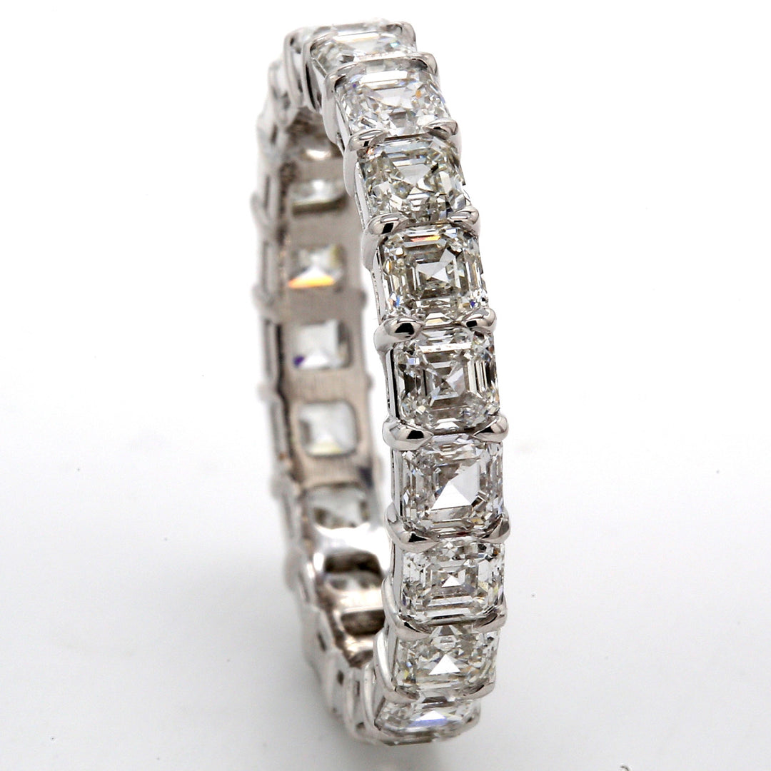 Eternity band in platinum with shared prong set (21) asscher cut diamonds.  D3.98ct.t.w.  Size 7