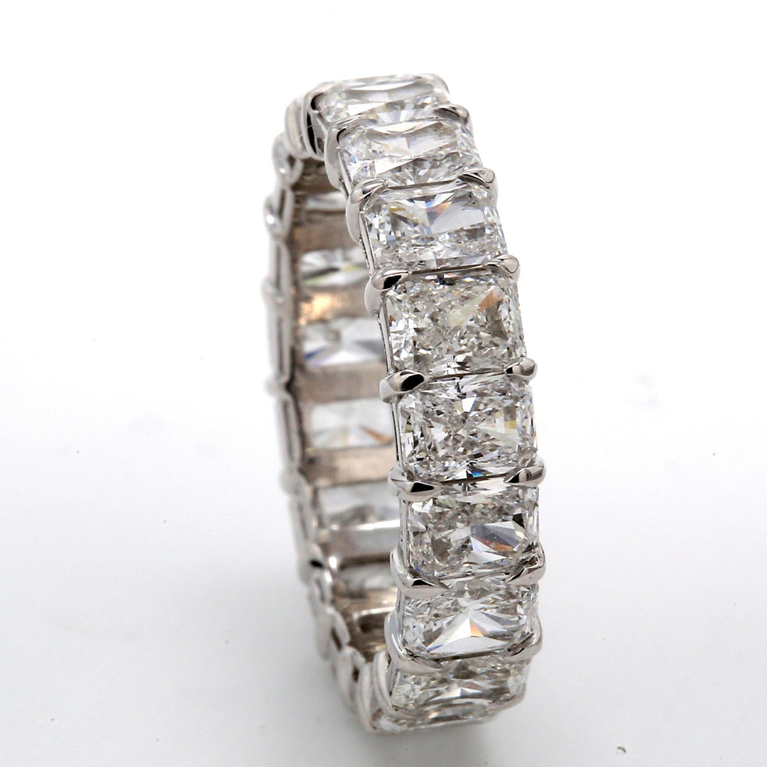 Eternity band in platinum with shared prong set (19) radiant cut diamonds.  D4.75ct.t.w.  Size 5