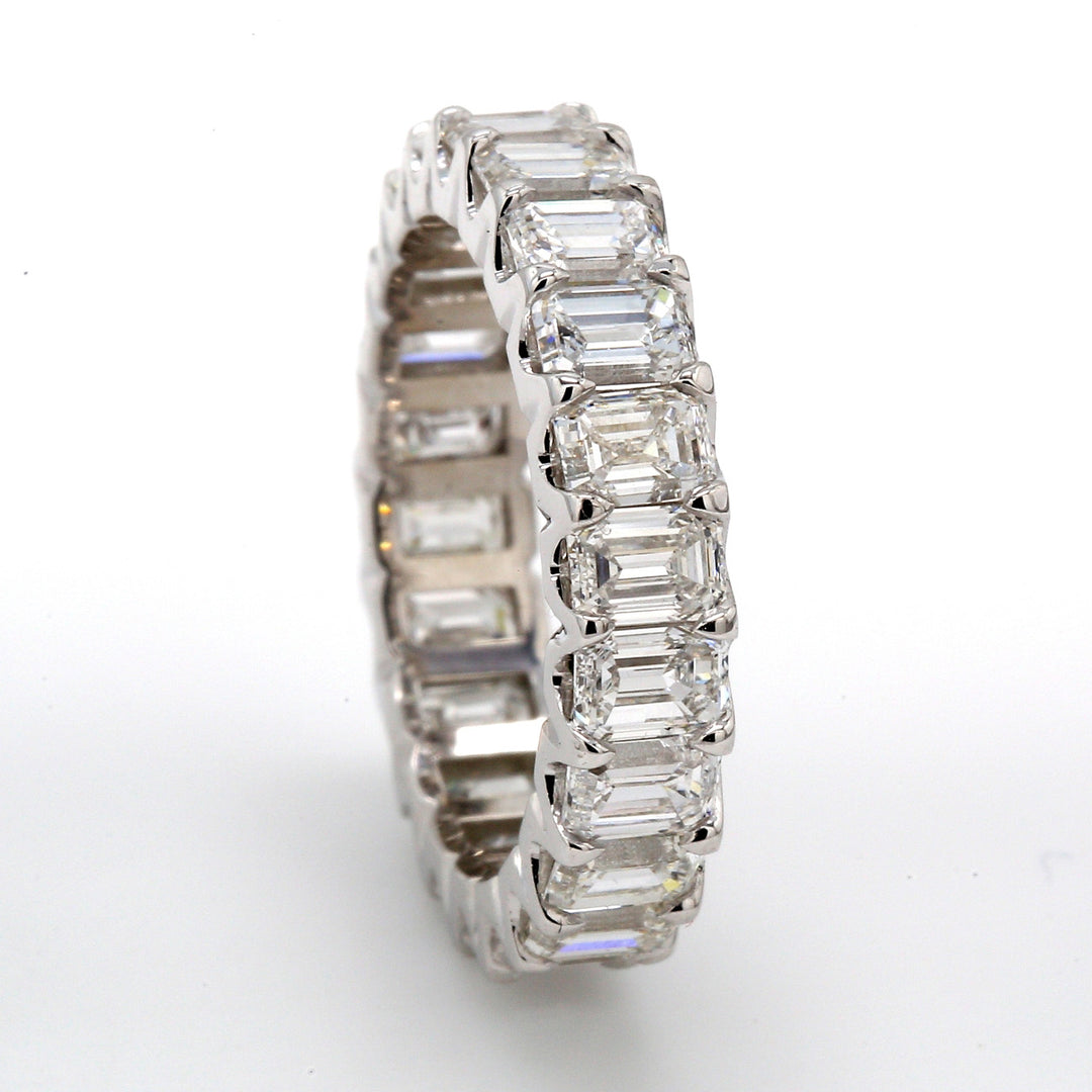 Eternity band in platinum with U-prong set (22) emerald cut diamonds.  D4.09ct.t.w.  Size 4.75