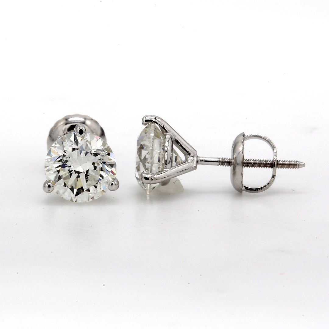 Screw back martini style stud earrings with 3-prong set USA certified H/SI2 round diamonds.  D3.00ct.t.w.