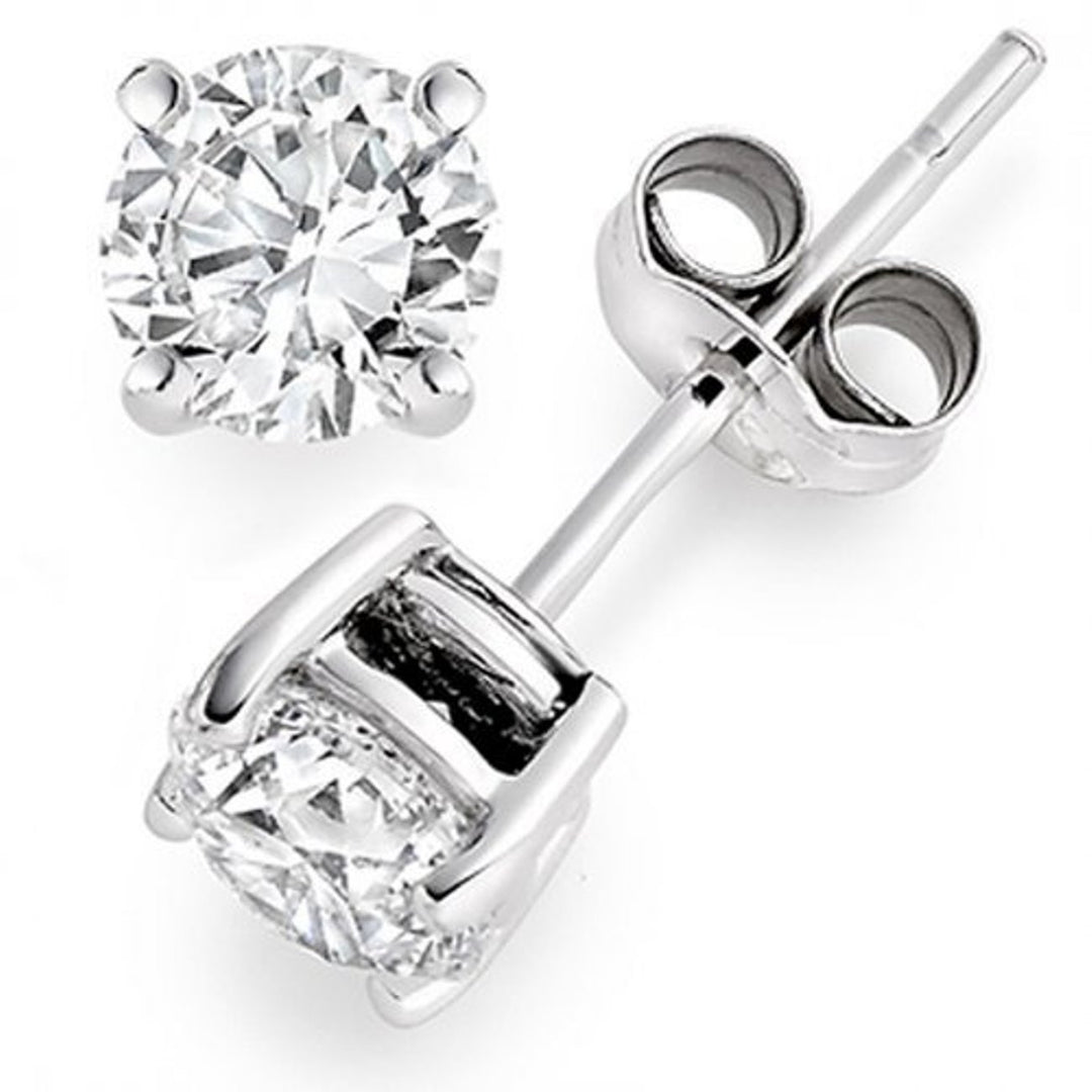 Push back stud earrings with 4-prong set round diamonds.  D1.42ct.t.w.