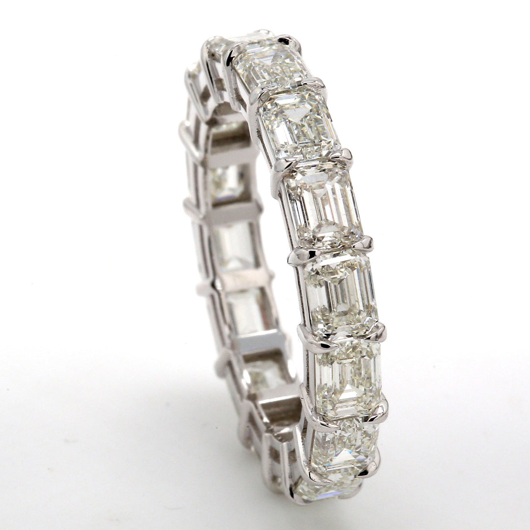 Eternity band east to west style in platinum with claw prong set (16) emerald cut diamonds.  D4.83ct.t.w.  Size 6