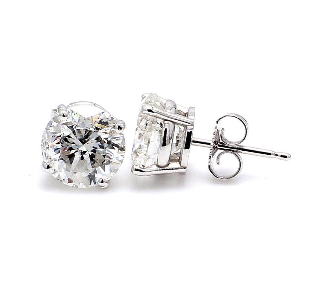 Screw back stud earrings with 4-prong basket set USA certified L-M/VS1 round diamonds.  D8.87ct.t.w.