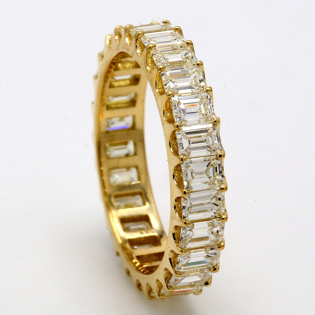 Eternity band in 18K YG with U-prong set (26) emerald cut diamonds.  D2.97ct.t.w.  Size 6