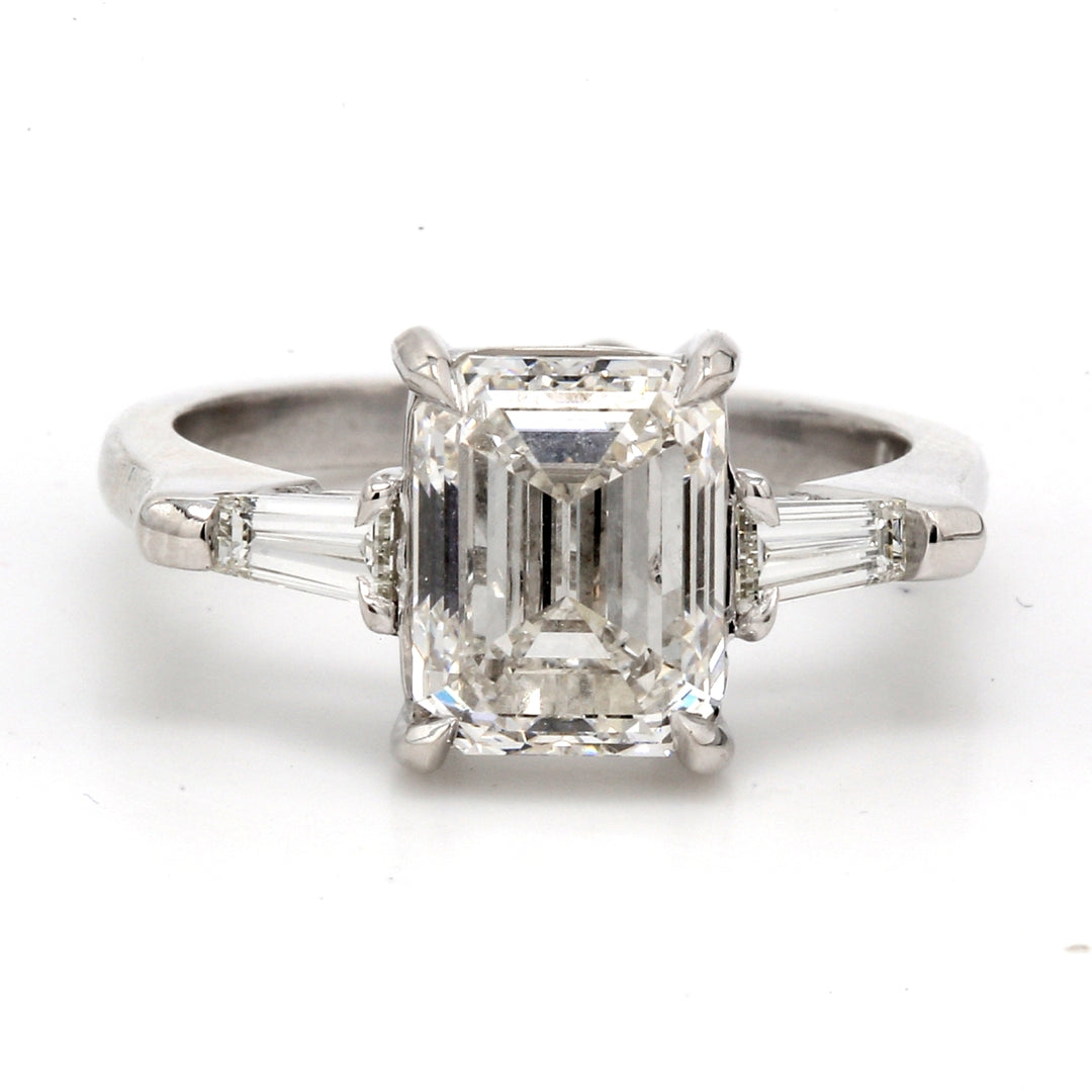 3-stone semi-mount with tapered baguette diamond sides.  D0.32ct.t.w.  Size 6