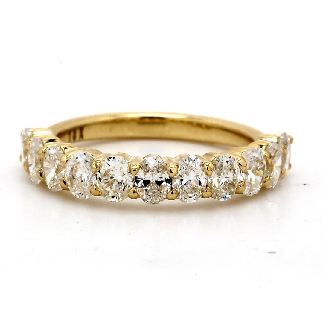 11-stone band in 18K YG with basket U-prong set oval diamonds.  D1.55ct.t.w.  Size 5.75