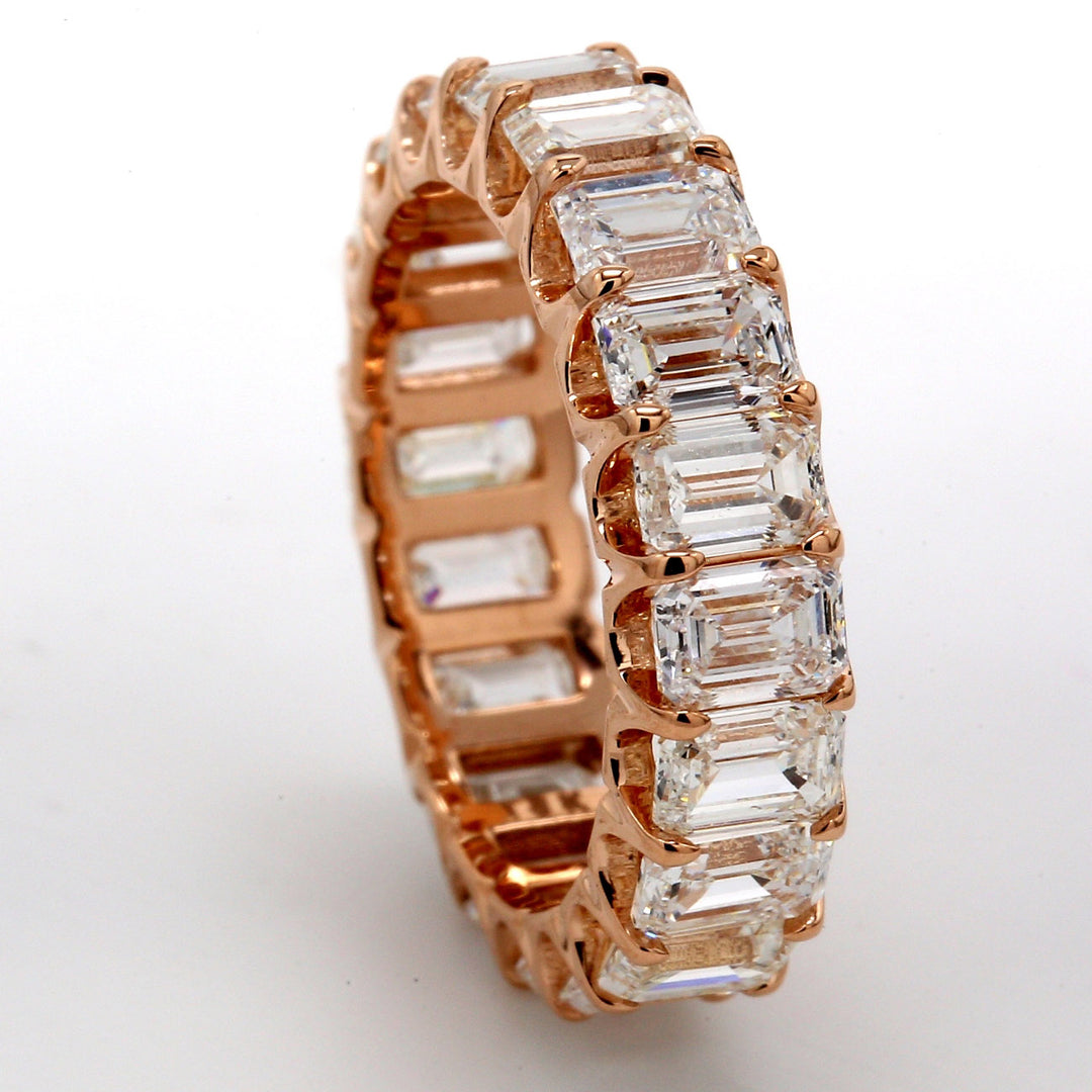 Eternity band in 18K RG with U-prong set (20) emerald cut diamonds.  D5.12ct.t.w.  Size 5