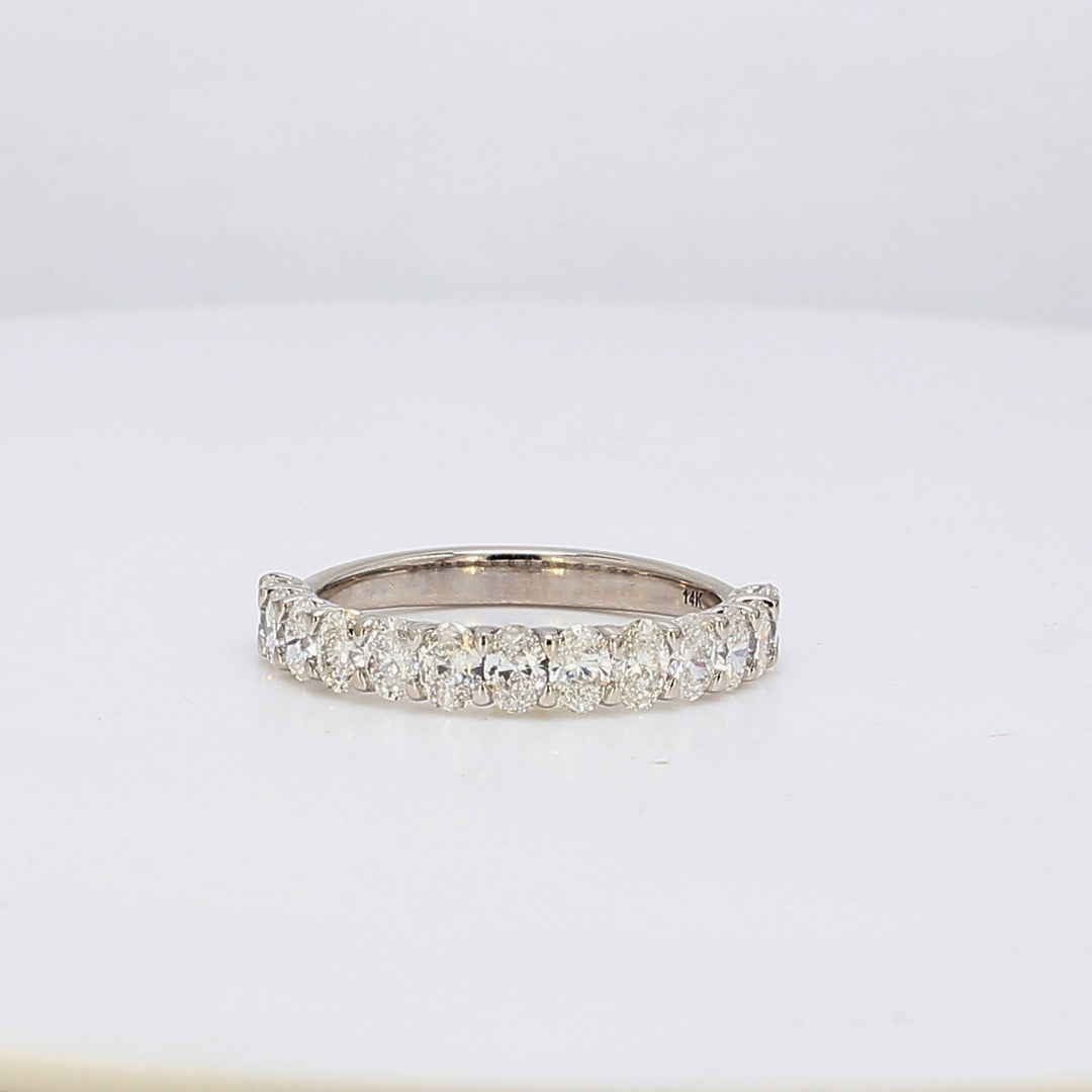 Band in white gold with half-way U-prong set oval diamonds.  D1.71ct.t.w.  Size 8.75