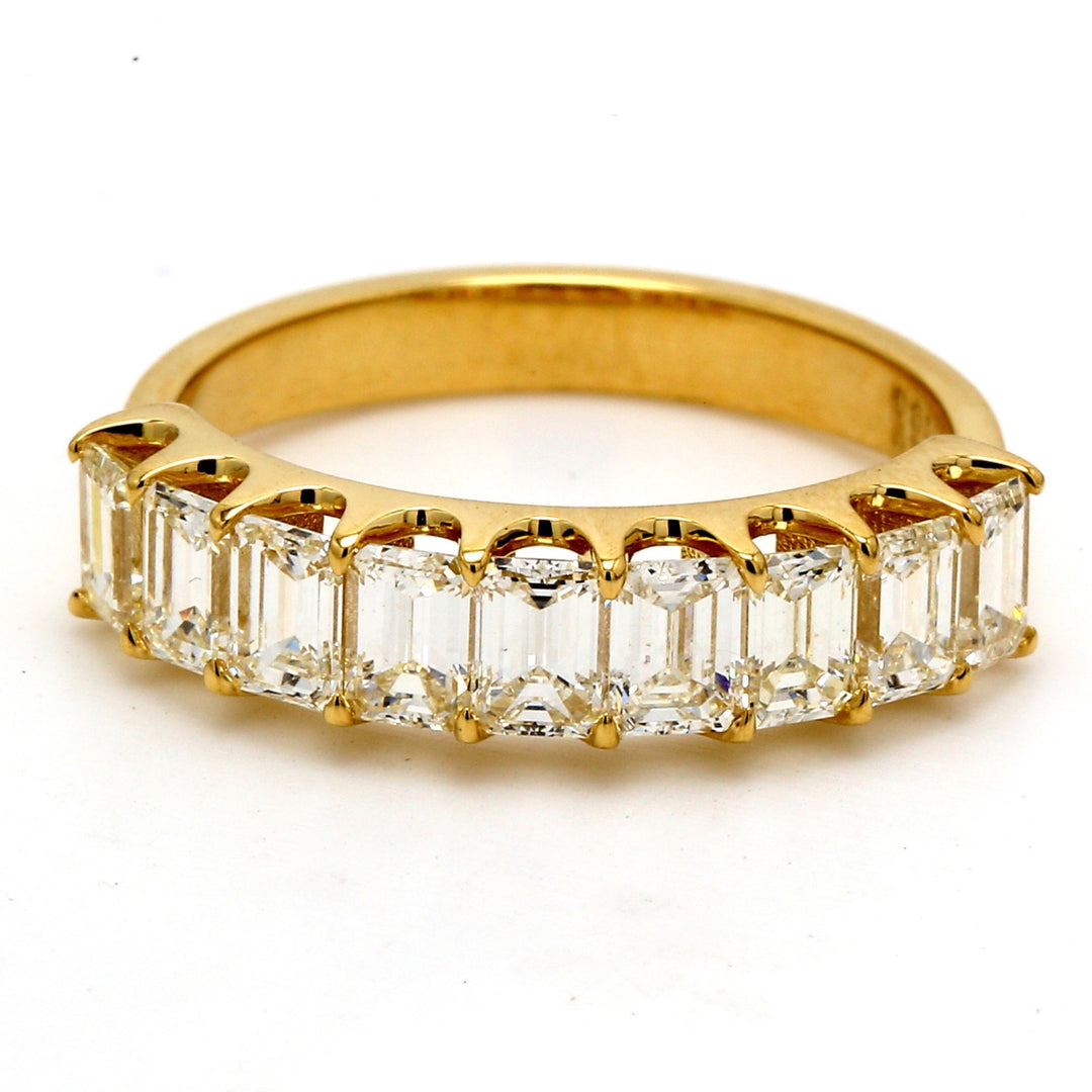 9-stone band in 18K YG with U-prong set emerald cut diamonds.  D1.76ct.t.w.  Size 6.5