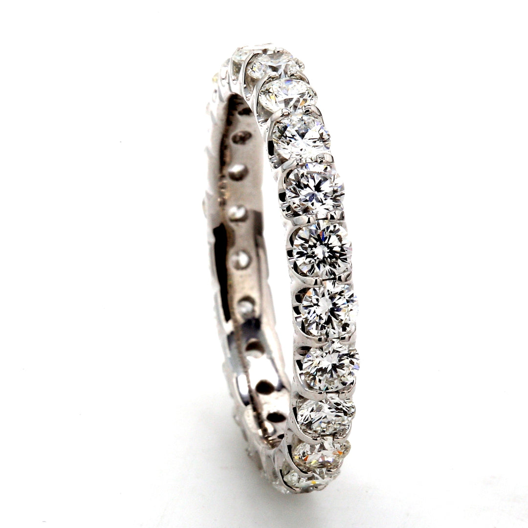 Eternity band in 18K WG with U-prong set (21) round diamonds.  D1.85ct.t.w.  Size 5