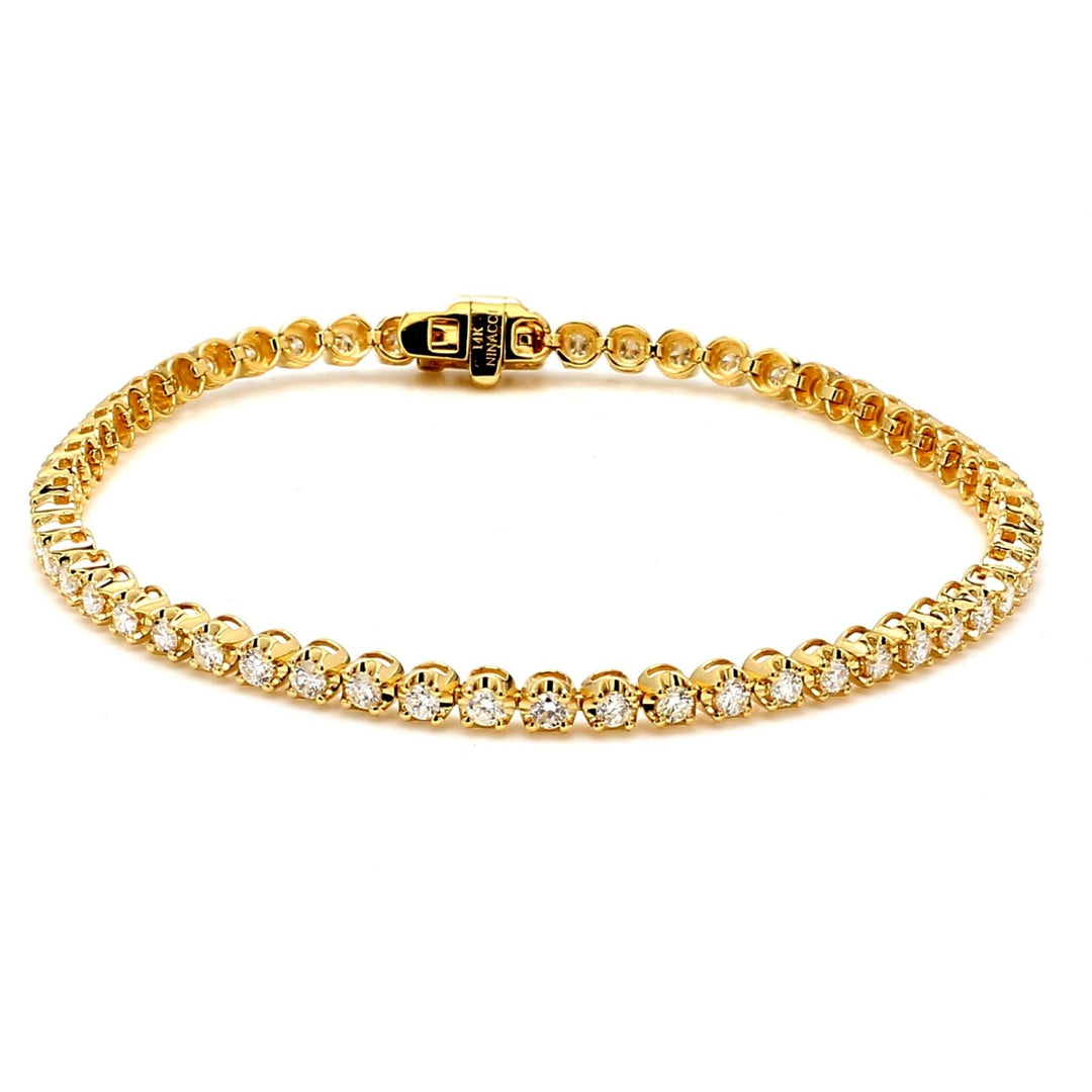 7"" Tennis bracelet in 14K YG with crown head prong set (56) round diamonds.  D1.87ct.t.w.