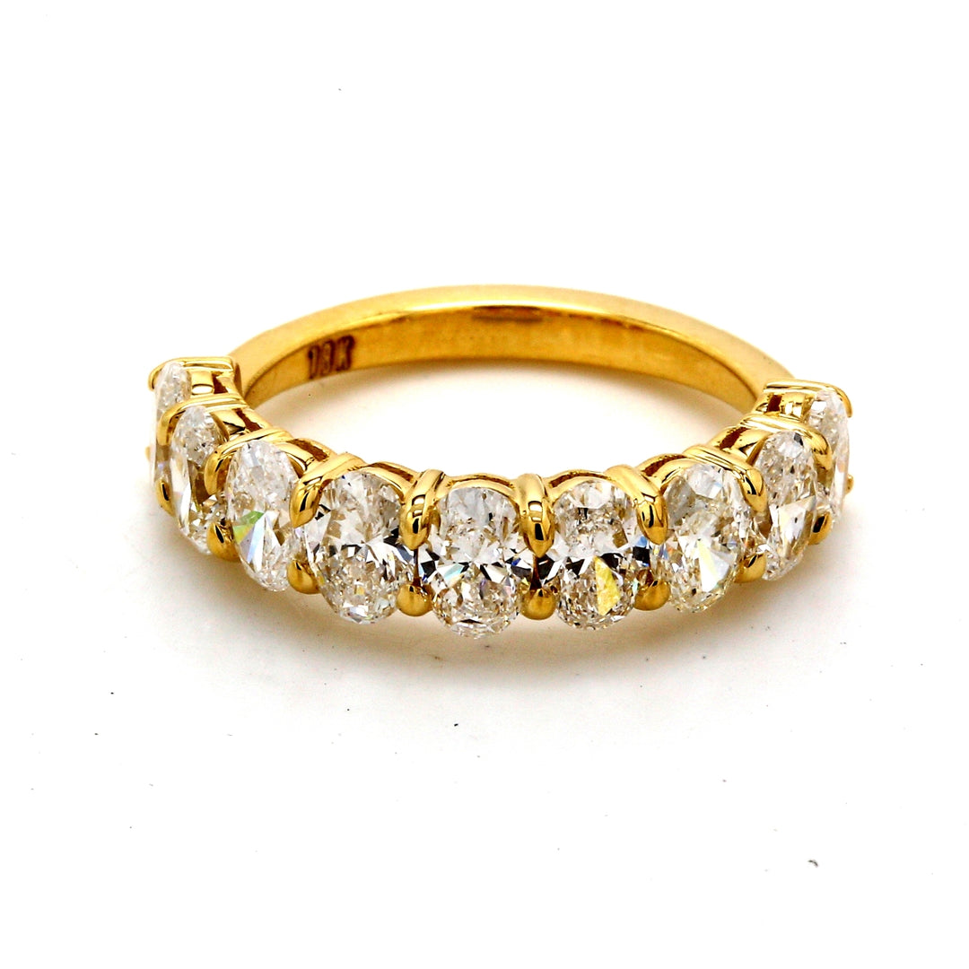 9-stone band in 18K YG with basket prong set oval cut diamonds.  D2.11ct.t.w.  Size 5