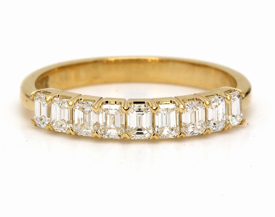 9-stone band in 18K YG with prong set emerald cut diamonds.  D0.80ct.t.w.  Size 6