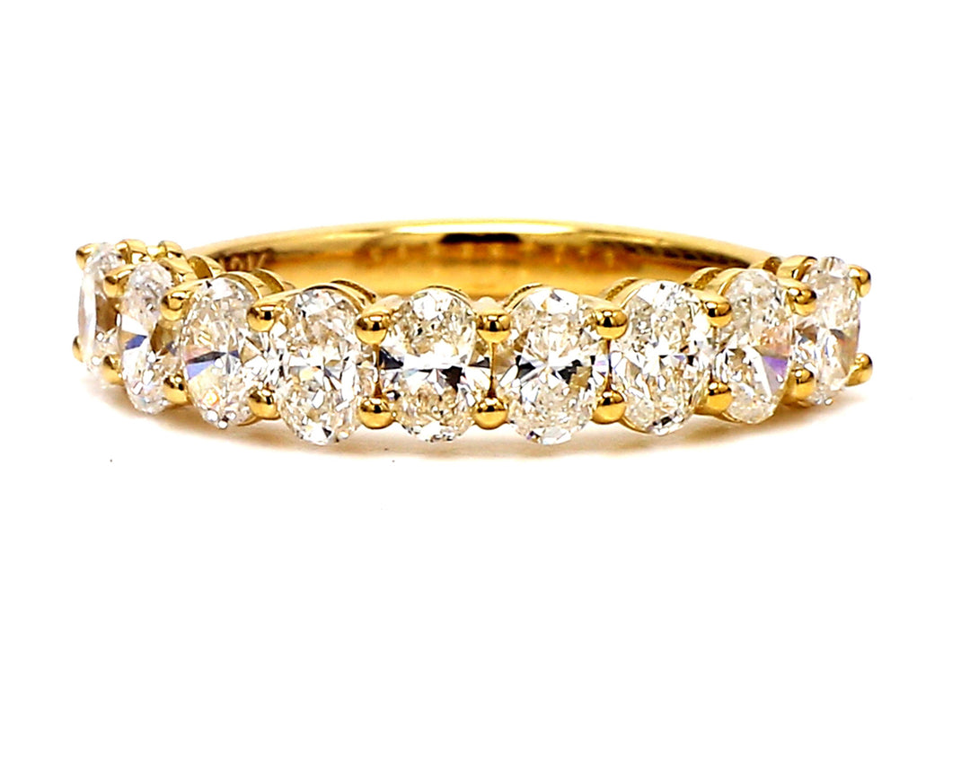 9-stone band in 18K YG with basket prong set oval cut diamonds.  D1.69ct.t.w.  Size 7.25