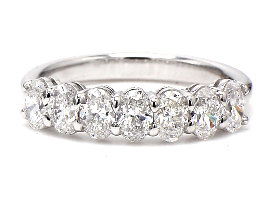 7-stone band in platinum with basket prong set oval cut diamonds.  D1.30ct.t.w.  Size 7