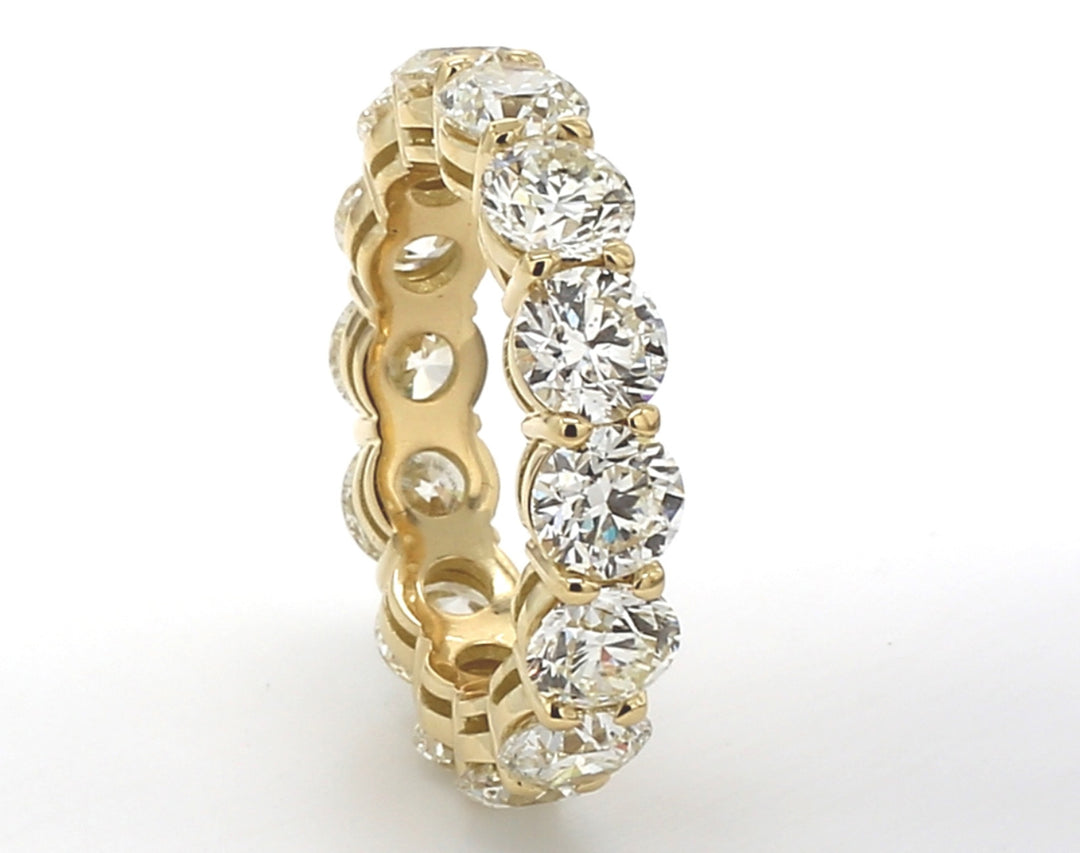 Eternity band in 18K YG with basket prong set round diamonds.  D7.03ct.t.w.  Size 7