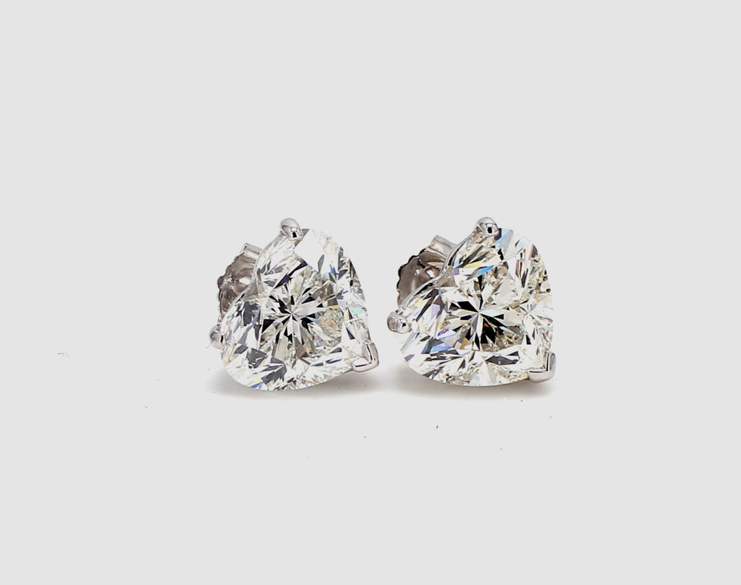 Push back stud earrings with 3-prong basket set GIA certified H-I/SI1-SI2 heart shape diamonds.  D6.02ct.t.w.