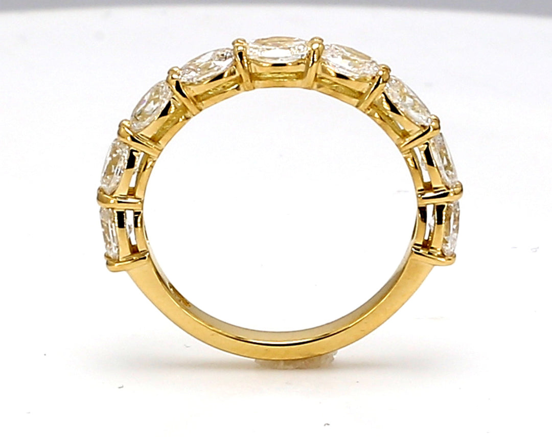 9-stone band east to west style in 18K YG with basket prong set oval cut diamonds.  D1.14ct.t.w.  Size 5.5