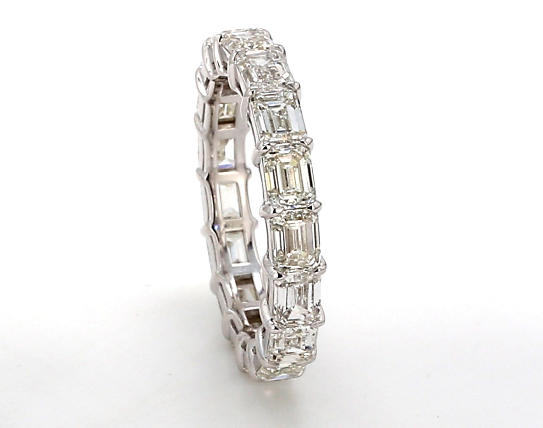 Eternity band east to west style with basket prong set (17) emerald cut diamonds.  D5.16ct.t.w.  Size 7.5