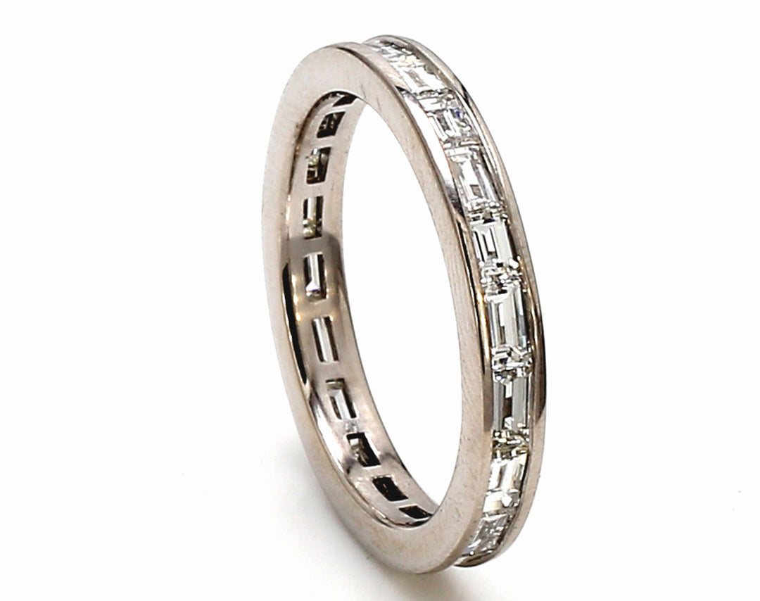 Eternity band in platinum with channl set (20) emerald cut diamonds.  D2.21ct.t.w.  Size 8