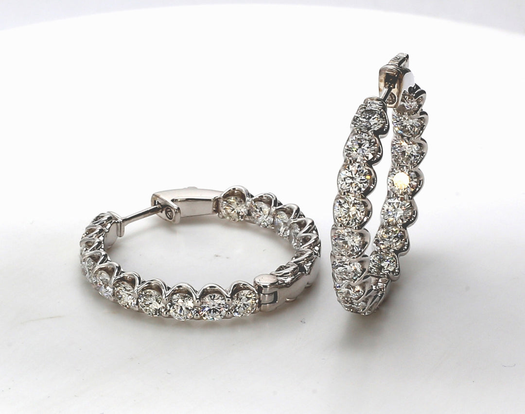 1"" Inside out hoop earrings w/ shared prong set round diamonds.  D6.26ct.t.w.