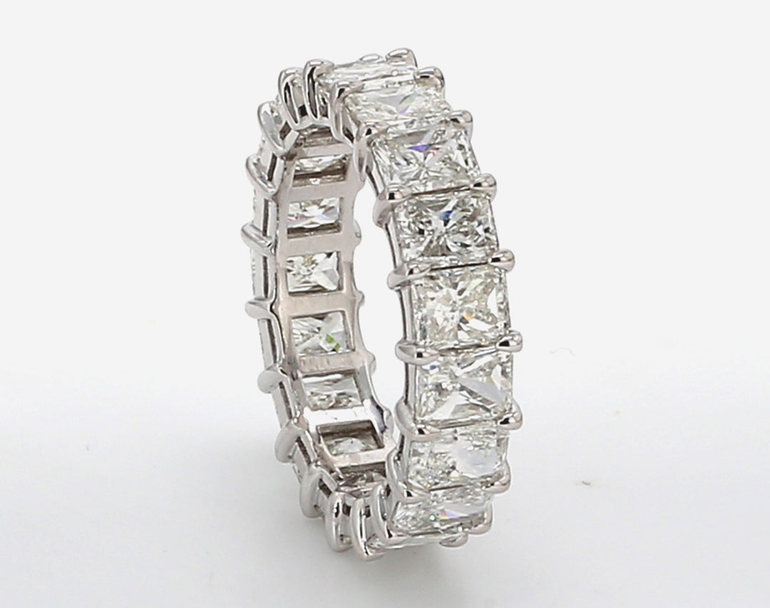 Eternity band in platinum w/ basket claw prong set (19) radiant cut diamonds.  D5.98ct.t.w.  Size 6.25