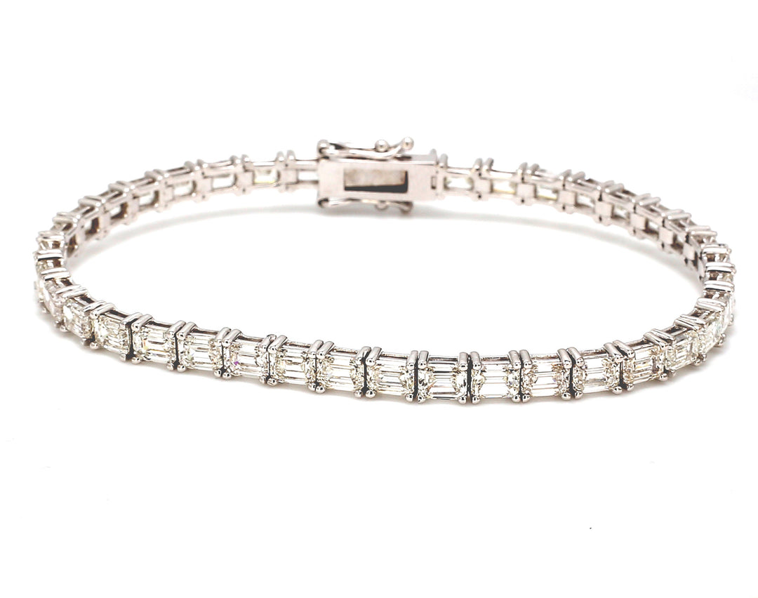 7"" Tennis bracelet east to west style with basket prong set (39) emerald cut diamonds.  D11.95ct.t.w.